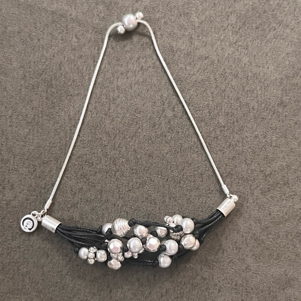 C1946 Silvertone bead and black cord adjustable bracelet